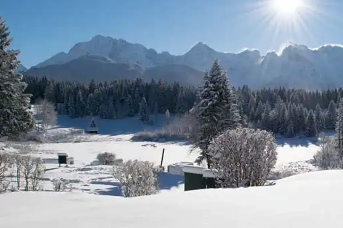 Winter landscape with mountains in the background